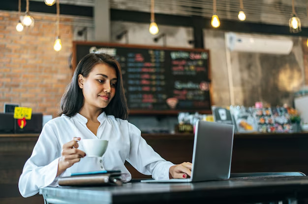 woman-sitting-working-with-laptop-coffee-shop